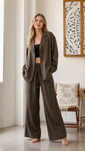 Front view of model wearing olive blazer and wide-leg pants set