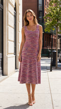Front view of woman wearing pink multi space dye knit midi dress
