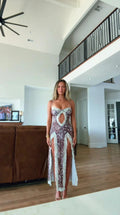 Front view of model wearing brown leopard print maxi dress with lace trim