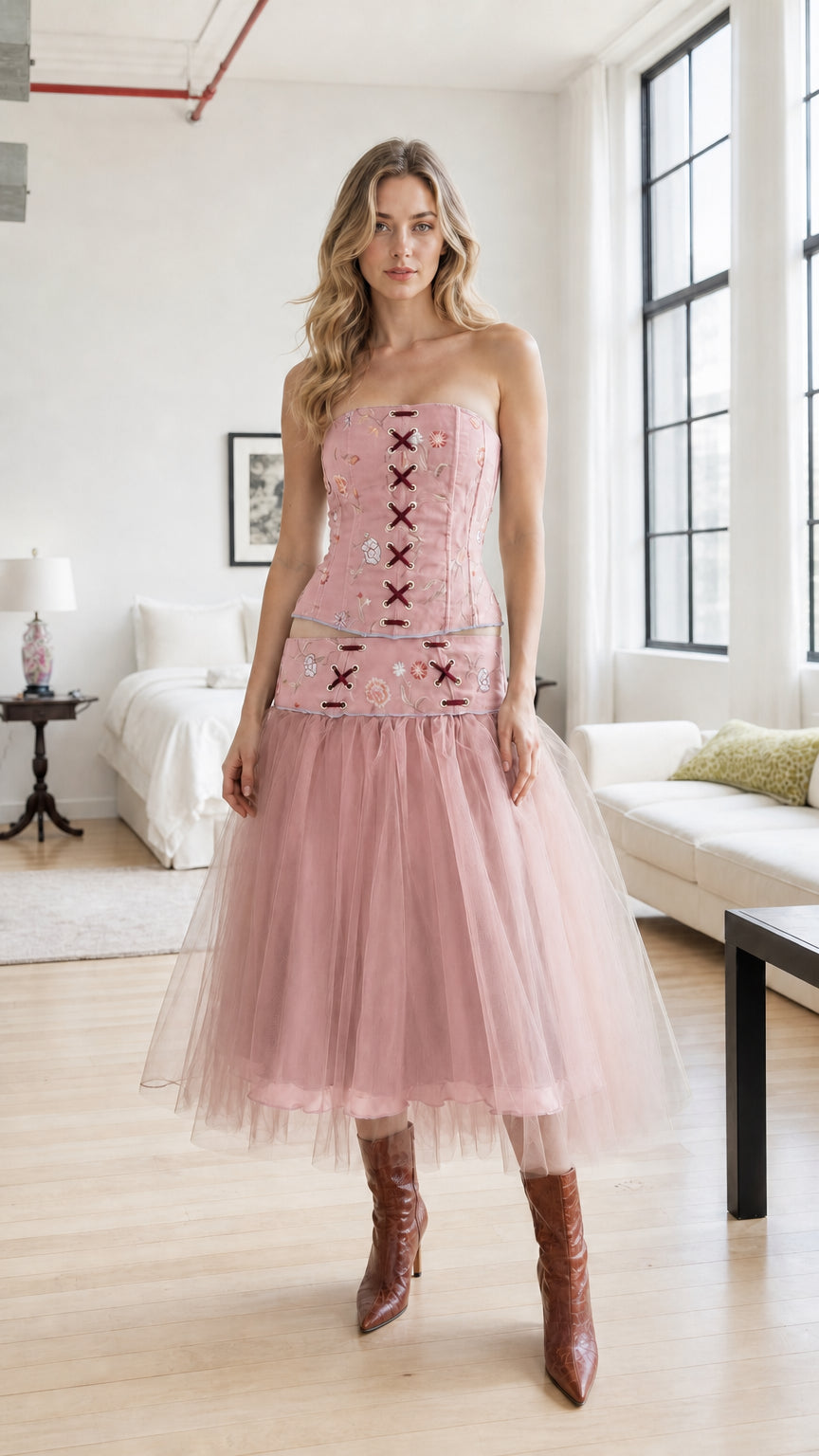 Model wearing dusty pink embroidered corset and tulle skirt set